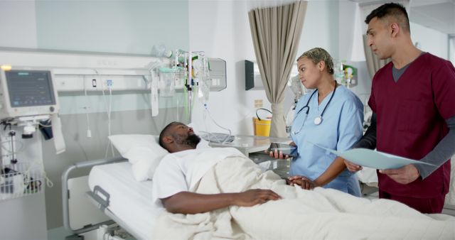 Medical Professionals Attending to Patient in Hospital Bed - Download Free Stock Images Pikwizard.com