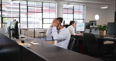 Successful Team Celebrating in Modern Office Workspace