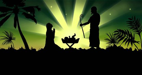 Silhouette of nativity scene against green background