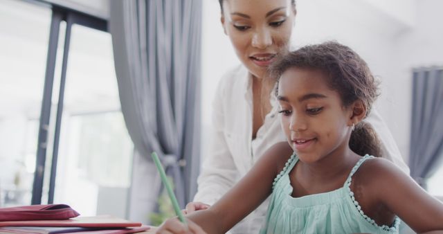 Patient Mother Helping Daughter with Homework - Download Free Stock Images Pikwizard.com