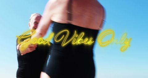 Happy Senior Couple Dancing Outdoors Under Blue Sky