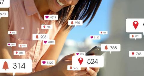 Smiling woman holding smartphone scrolling with social media notification badges