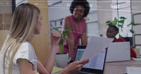 Blonde woman guiding diverse team collaborating on financial analytics with data overlays