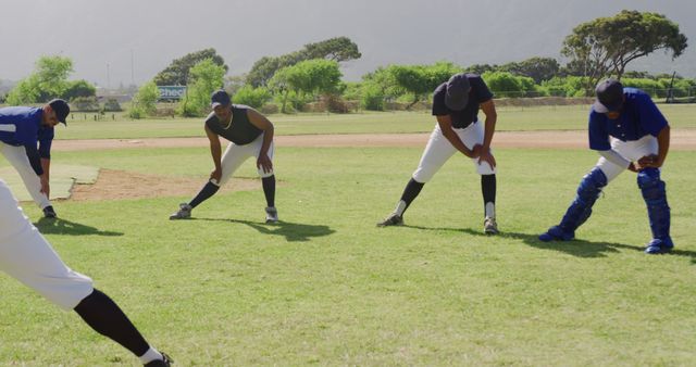 Baseball Players Stretching Before Game on Field - Download Free Stock Images Pikwizard.com