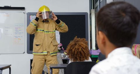 Firefighter Demonstrating Safety Techniques to Attentive Schoolchildren - Download Free Stock Images Pikwizard.com