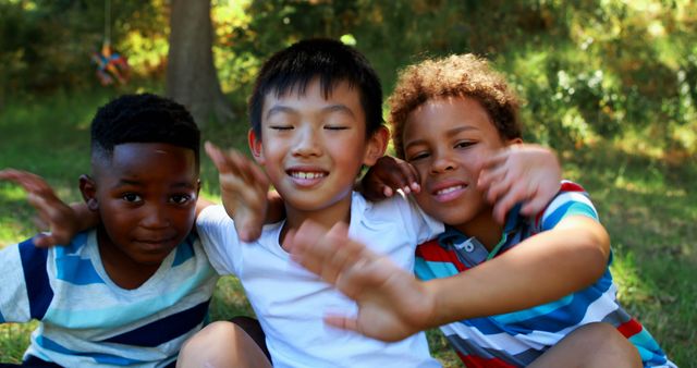 Diverse Boys Smiling and Hugging Outdoors in Park - Download Free Stock Images Pikwizard.com