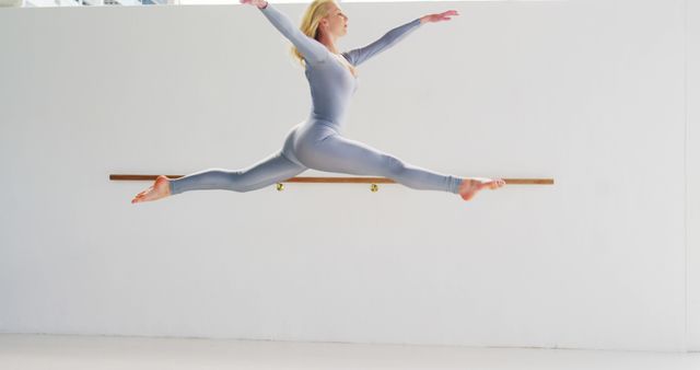 Ballet Dancer in Motion Leaping in Studio - Download Free Stock Images Pikwizard.com