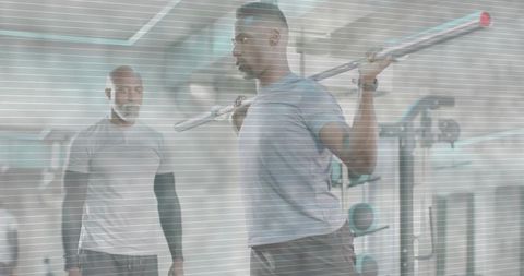Athlete lifting barbell at squat rack with trainer supervising strength training session