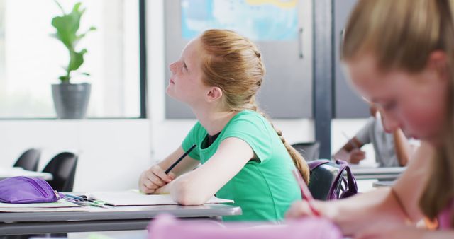 Girl Daydreaming During Classroom Lesson - Download Free Stock Images Pikwizard.com