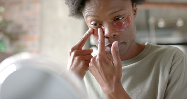 Man Applying Under-Eye Patches in Morning Routine - Download Free Stock Images Pikwizard.com