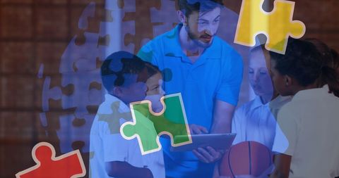 Teacher engaging schoolchildren with tablet learning