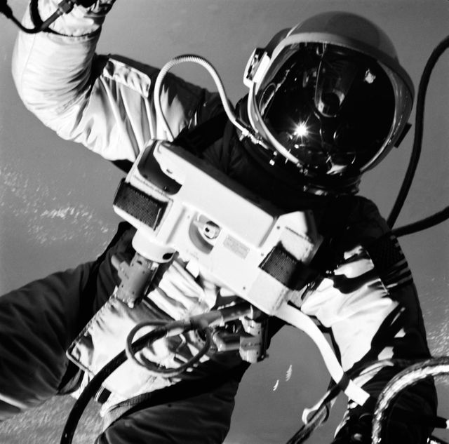 S65-30271 (3 June 1965) --- Astronaut Edward H. White II, pilot on the Gemini-Titan IV (GT-4) spaceflight, floats in the zero gravity of space outside the Gemini IV spacecraft. His face is covered by a shaded visor to protect him from the unfiltered rays of the sun. White became the first American astronaut to walk in space. He remained outside the spacecraft for 21 minutes during the third revolution of the Gemini IV mission. He wears a specially designed spacesuit for the EVA. His right hand (out of frame) is holding the Hand-Held Self-Maneuvering Unit (HHSMU), with which he controlled his movements while in space, and a camera is attached to the HHSMU. He was attached to the spacecraft by a 25-feet umbilical line and a 23-feet tether line, both wrapped together with gold tape to form one cord. He wears an emergency oxygen supply check pack. Astronaut James A. McDivitt is command pilot for the GT-4 mission. The mission was a four-day, 62-revolution flight, during which McDivitt and White performed a series of scientific and engineering experiments. (This image is black and white) Photo credit: NASA    EDITOR?S NOTE: Astronaut Edward H. White II died in the Apollo/Saturn 204 fire at Cape Kennedy, Florida, on Jan. 27, 1967.