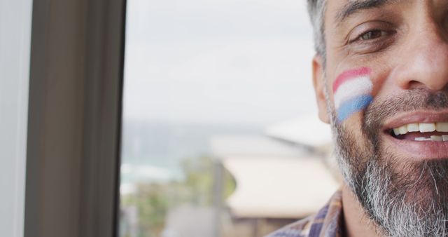 Proud Man Displaying Dutch Flag Face Paint - Download Free Stock Images Pikwizard.com