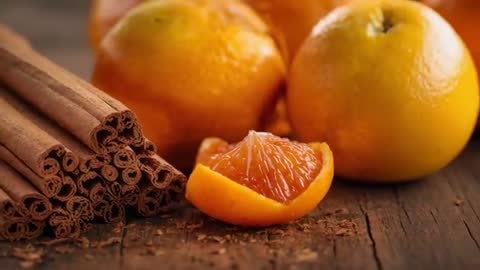 Citrus and Cinnamon Close-Up Revealing Juicy Orange Segment on Rustic Wood