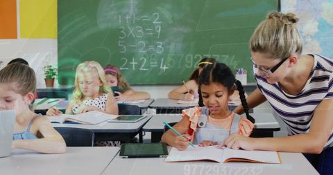 Teacher Guiding Diverse Students Amidst Digital Interface in Classroom - Download Free Stock Images Pikwizard.com