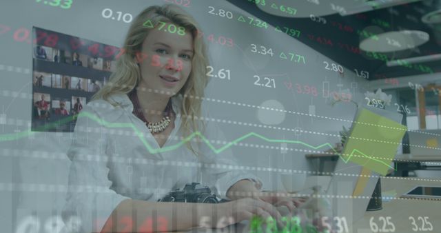 Smiling Businesswoman Analyzing Stock Market Data on Laptop in Modern Office - Download Free Stock Images Pikwizard.com