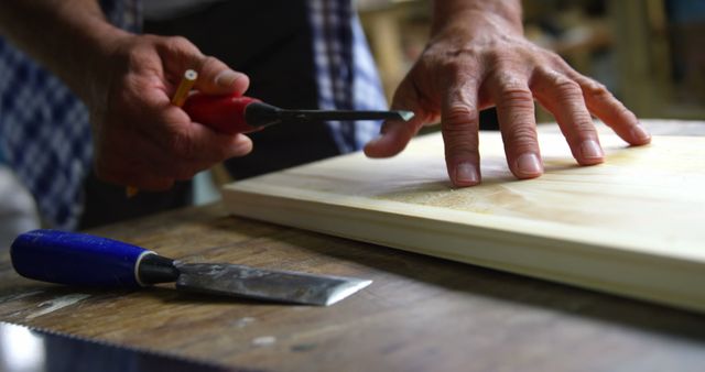 Carpenter Working with Chisel and Wooden Plank in Workshop - Download Free Stock Images Pikwizard.com