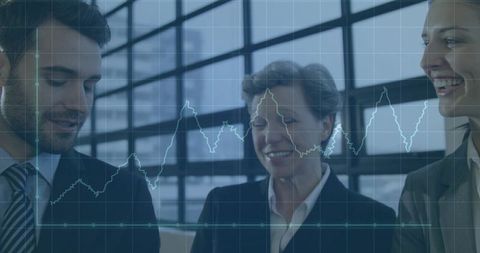 Business team discussing financial line chart in modern office with glass windows