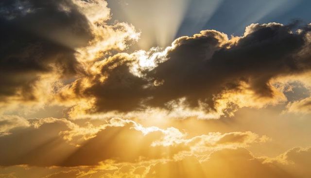 Sunset Crepuscular Rays Piercing Through Dark Cumulus Clouds Golden Dramatic Sky Sunbeams