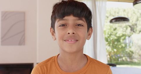 Smiling Boy Inside Cozy Modern Home with Minimalist Decor