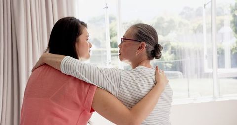 Caring Mother and Daughter Sharing an Intimate Moment