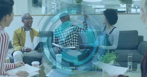 Colleagues collaborating in office lounge with futuristic hologram