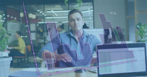 Businessman Analyzing Financial Graphs in Modern Office - Download Free Stock Images Pikwizard.com