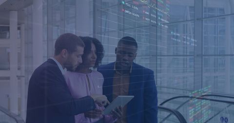 Diverse Business Team Analyzing Stock Market Data on Tablet - Download Free Stock Images Pikwizard.com