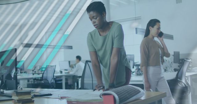 Modern office scene showing female architects engaged in project design. Ideal for use in corporate presentations, marketing materials, or articles about workplace collaboration, architecture, or urban planning.