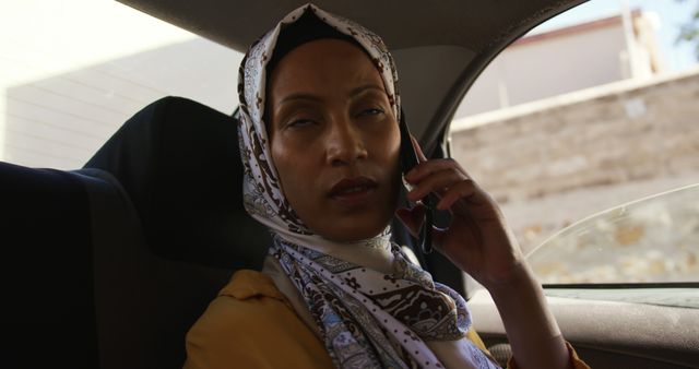 Woman Wearing Hijab Talking on Phone Inside Car - Download Free Stock Images Pikwizard.com