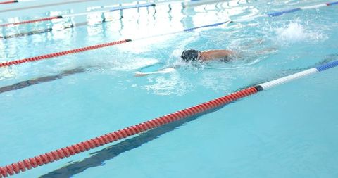 Athlete Demonstrating Freestyle Technique in Indoor Pool - Download Free Stock Images Pikwizard.com