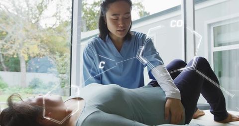 Physiotherapist using ar technology for patient rehabilitation