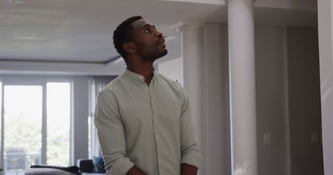 Thoughtful Young Man Enjoying Tranquility at Home