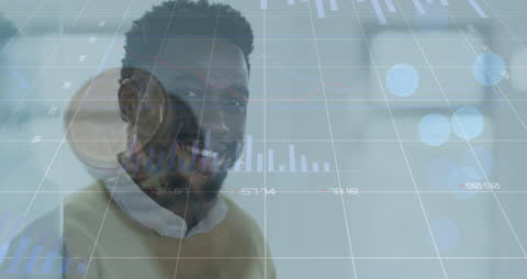 Businessman Overlaid with Financial Analytics Charts