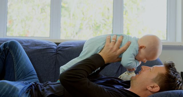 Father Bonding with Baby on Couch During Daytime - Download Free Stock Images Pikwizard.com