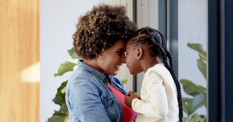 Parent and child affectionate moment in natural light