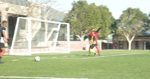 Team Soccer Players Practicing on Sunny Field