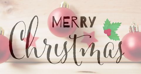 Merry christmas message over red ornament decorations