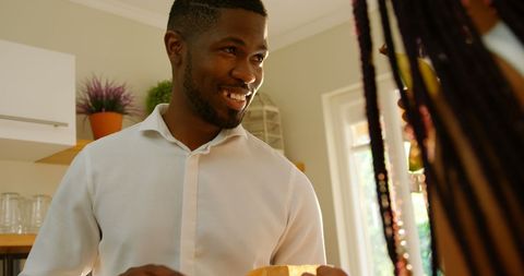 Happy Father and Son Bonding in Bright Kitchen Environment