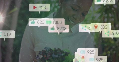 Woman engaging with social media in garden setting