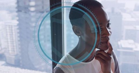 Gazing business leader at office window with city skyline and futuristic HUD overlay