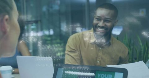 Business Discussion in Modern Office with Digital Displays