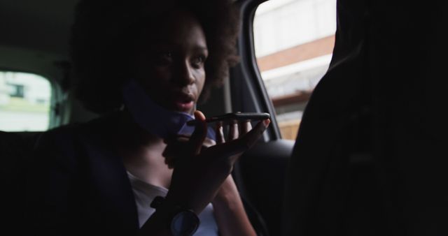 Busy Businesswoman Communicating on Phone During Commute in Car Interior - Download Free Stock Images Pikwizard.com