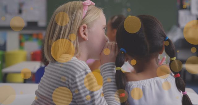 Two Diverse Girls Whispering Secrets in Classroom - Download Free Stock Images Pikwizard.com