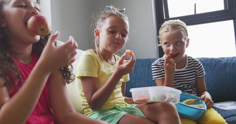 Happy Diverse School Girls Enjoying Lunch Together
