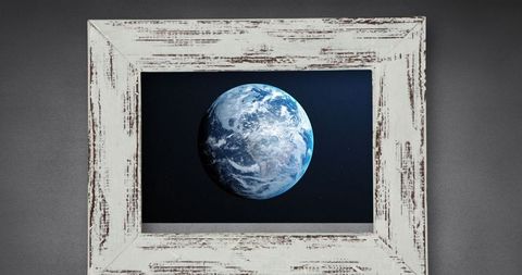 Framed Earth Globe Against Textured Gray Background