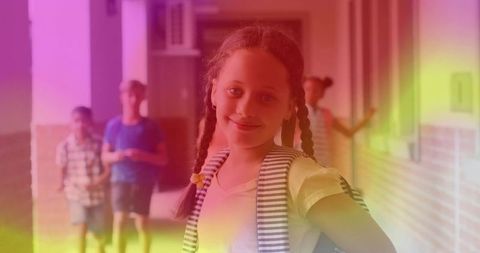 Schoolgirl with Braided Hair Emotionally Confident in Colorful Hallway