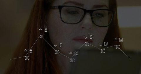 Business professional analyzing data on tablet with line graph overlay