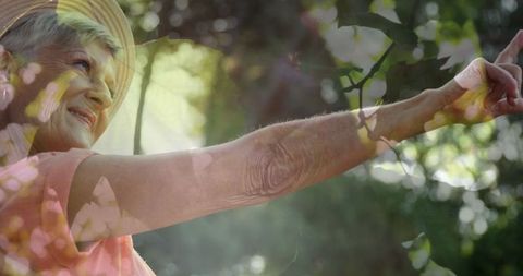 Senior Woman Enjoying Nature with Sunlight Filter