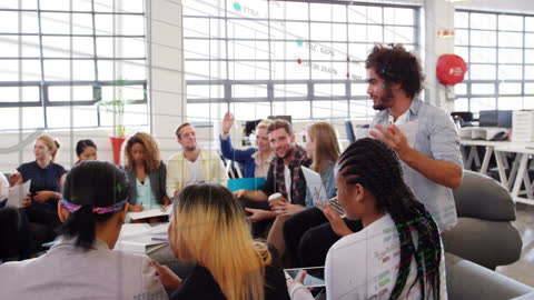 Diverse Team Engaged in Collaborative Meeting with Data Animation